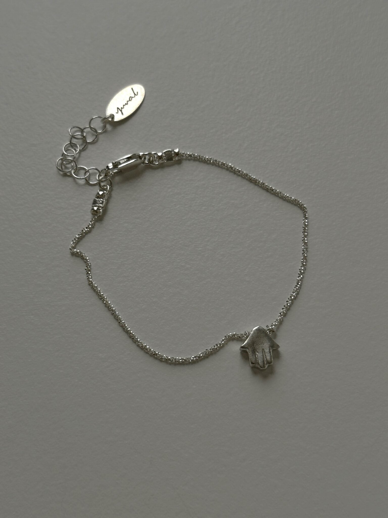 Mishel & Hamsa bracelets silver