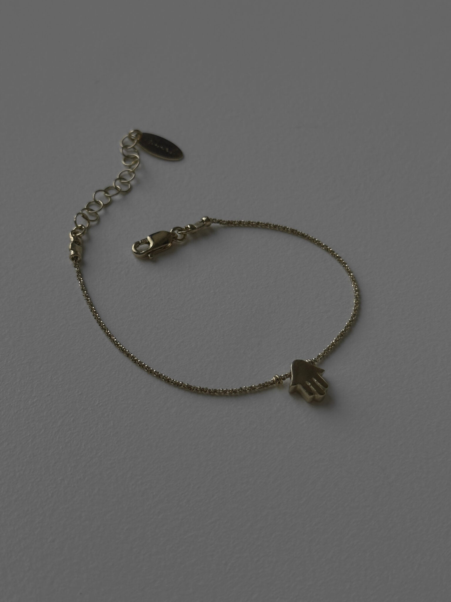 Mishel & Hamsa bracelets gold