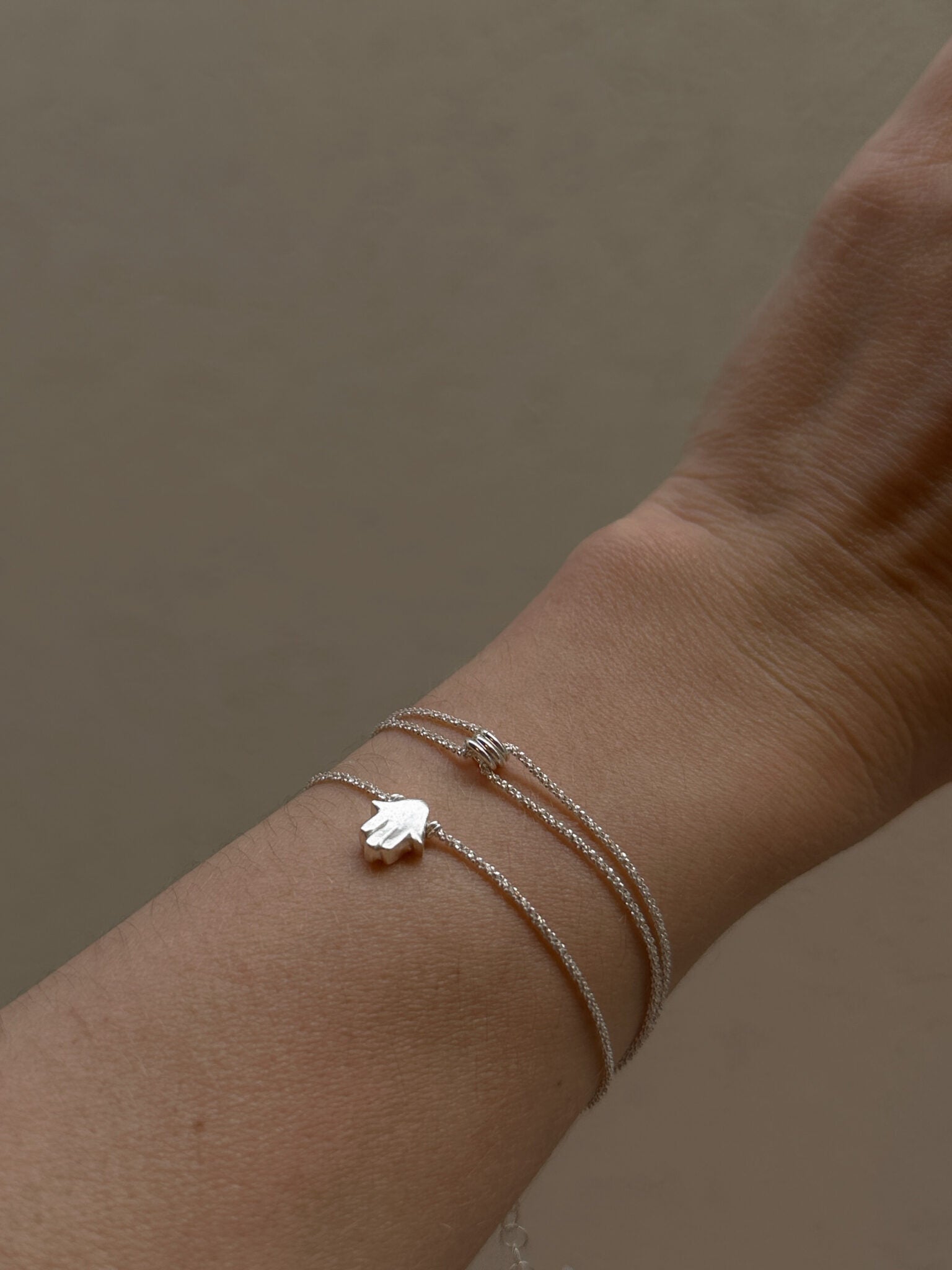 Mishel & Hamsa bracelets silver