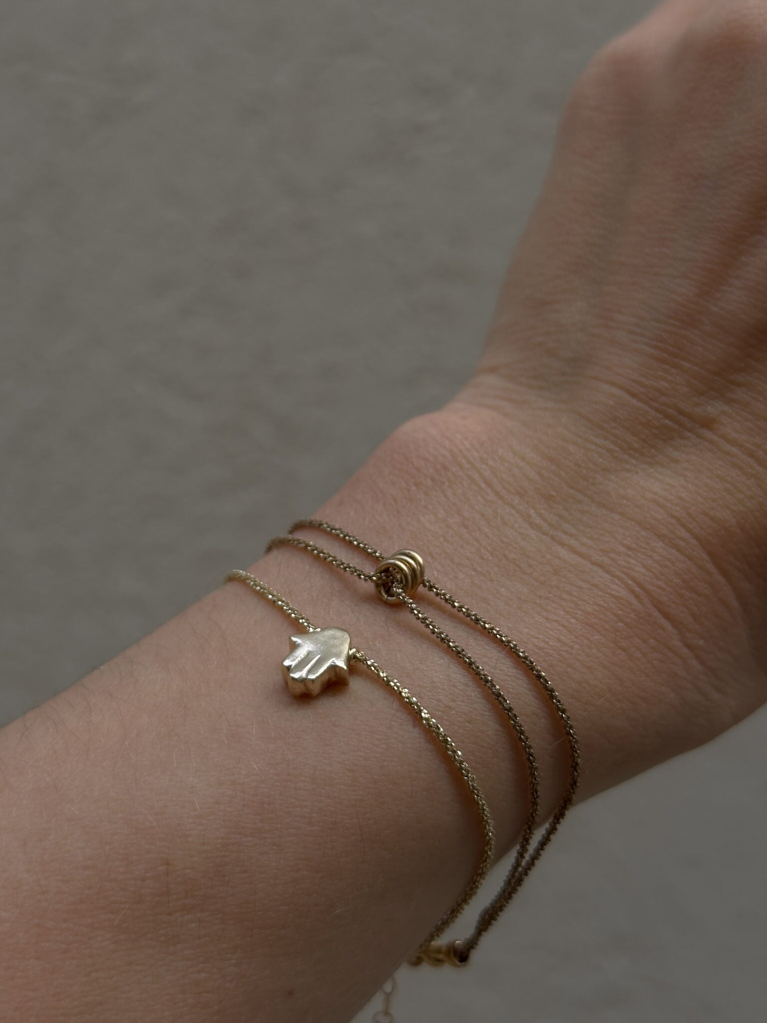 Mishel & Hamsa bracelets gold