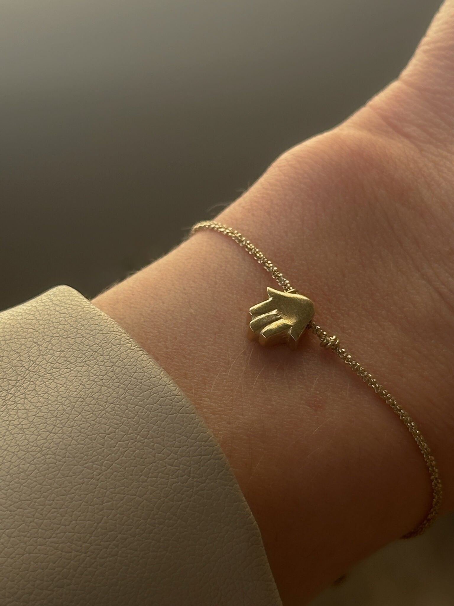 Mishel & Hamsa bracelets gold